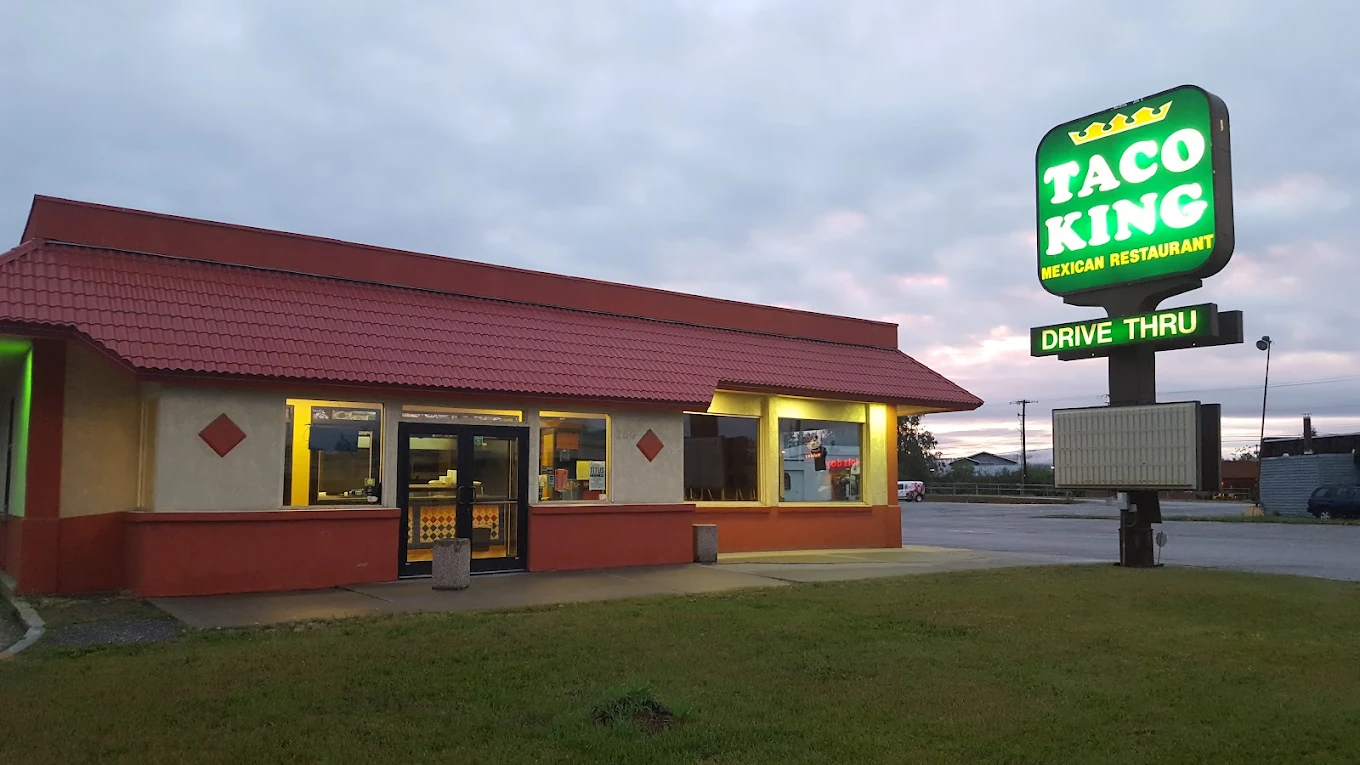 Taco King storefront at dusk